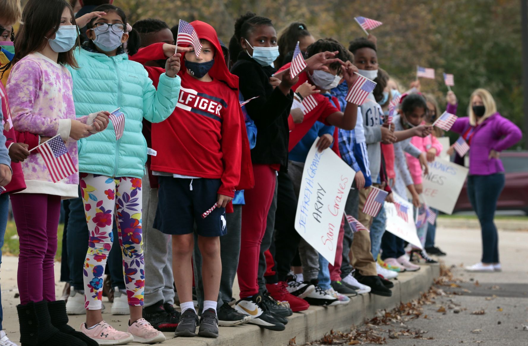 Students honor veterans with drive-by parade
